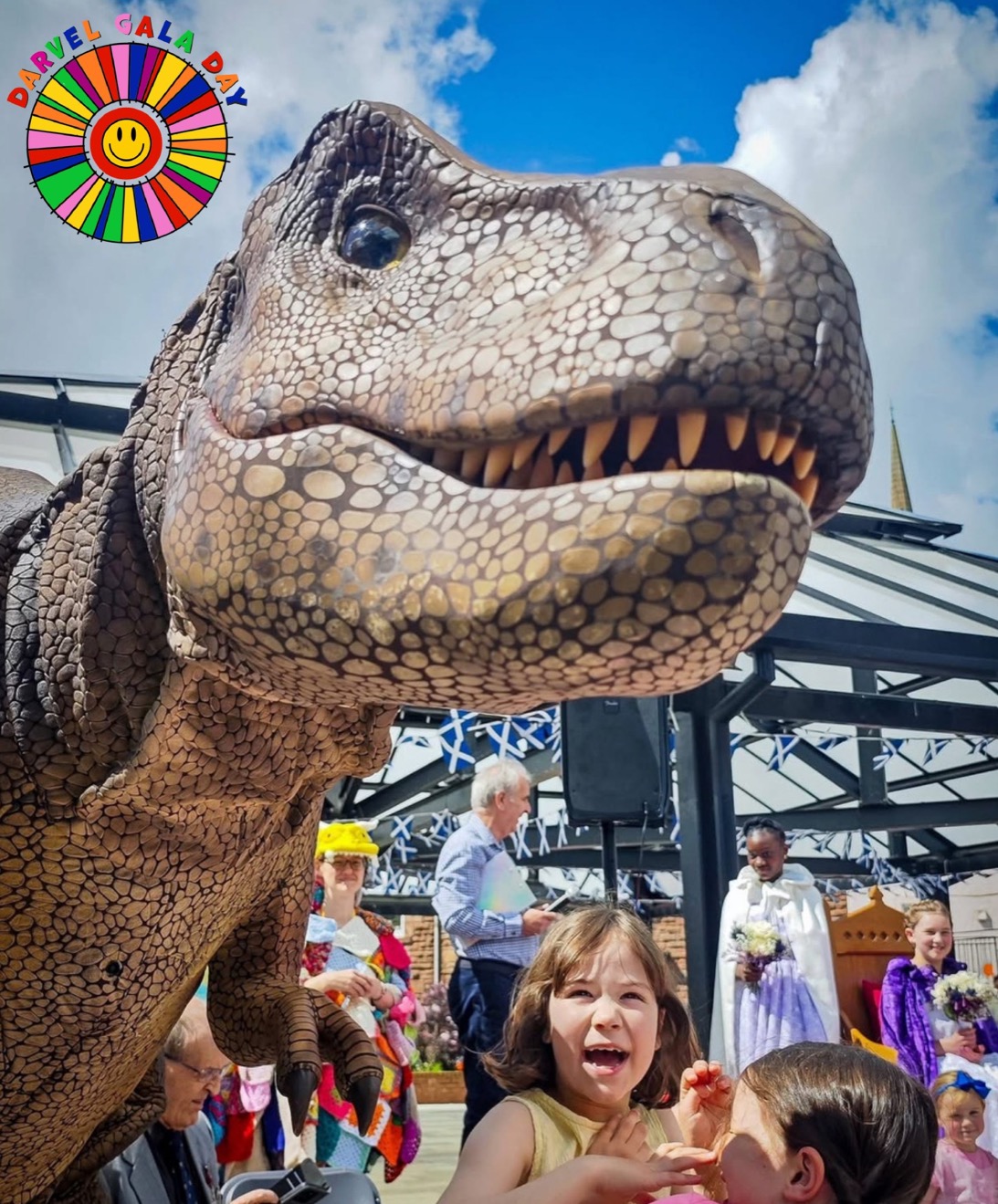 A dinosaur meeting families at Darvel Gala Day 2026