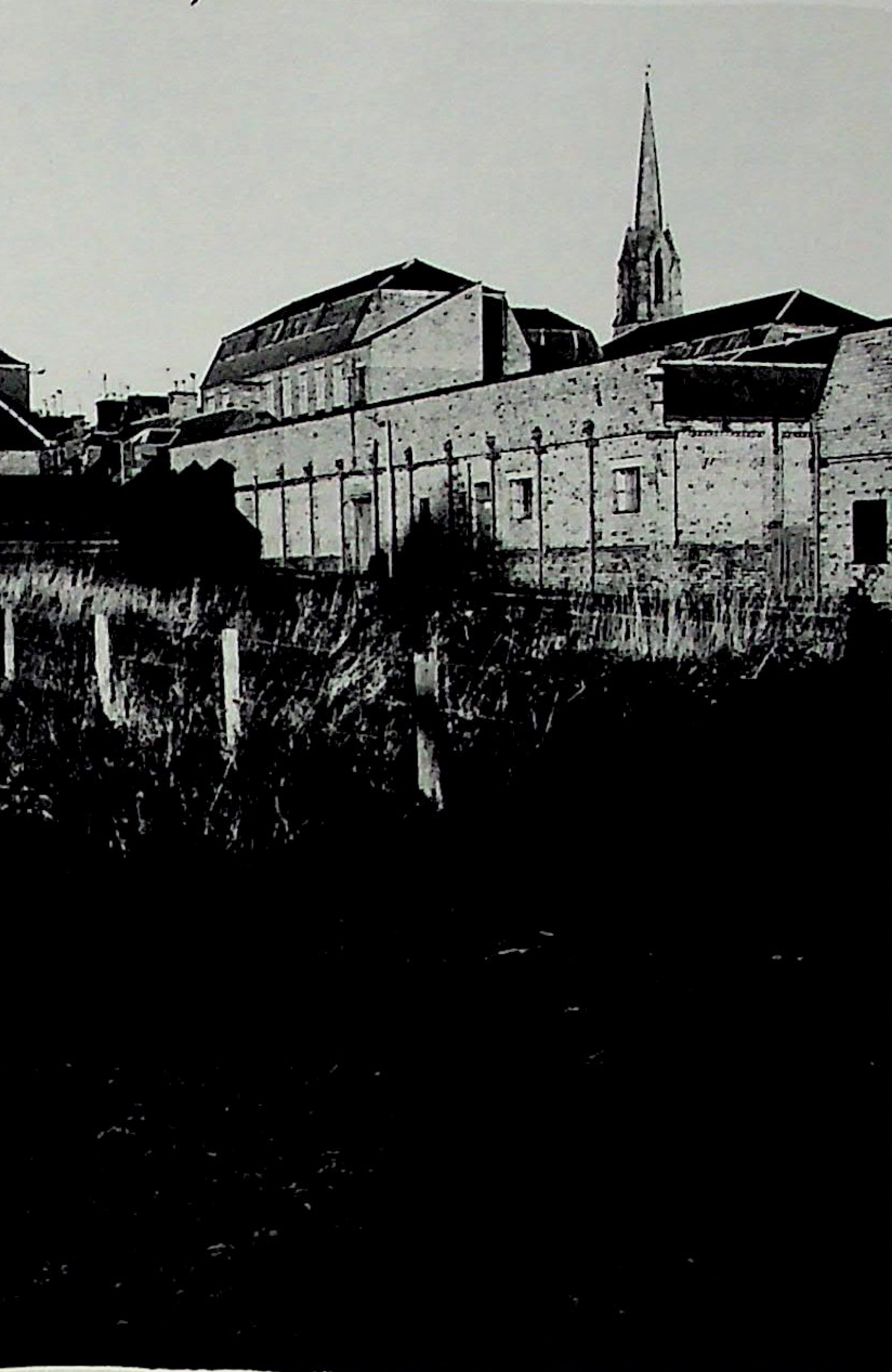 Westward view across the long Morton factory complex with Darvel church spire behind