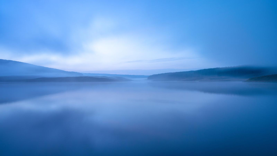 A blue-toned landscape photograph by Hugh Maxwell