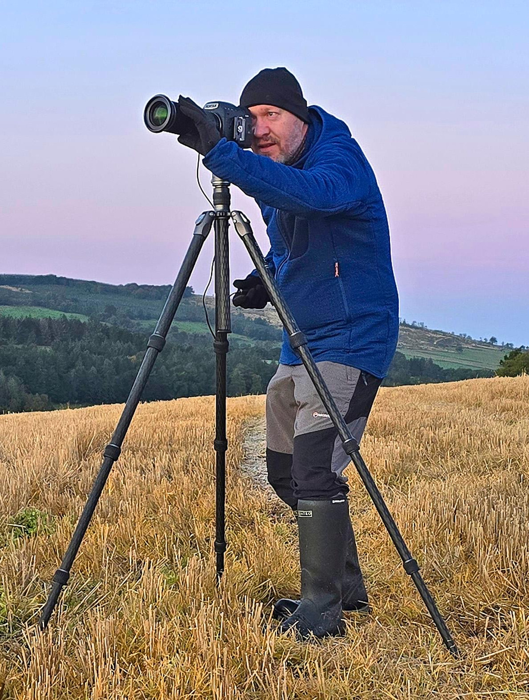 Hugh Maxwell using a camera and tripod in the Ayrshire countryside