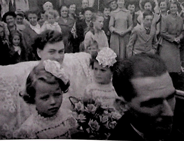 Mary Wilson travelling by car during the 1951 Lace Queen celebration
